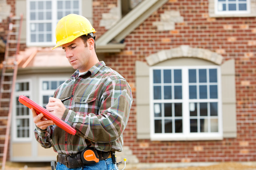 licensed home inspector writing an inspection report